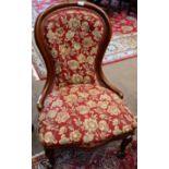 A Victorian Mahogany Framed Nursing Chair, 3rd quarter 19th century, with a moulded frame and