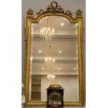 A Late Victorian Gilt and Gesso Overmantel Mirror, late 19th century, the bevelled glass arched