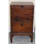 A George III Mahogany Chest, the hinged lid above a long drawer and fall front, raised on a stand