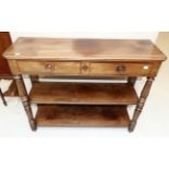 An Early 19th Century Mahogany Side Table, of canted rectangular form with two frieze drawers,