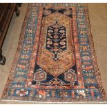 Malayir Rug West Iran, circa 1920 The indigo field centred by a stepped lozenge panel framed by pale