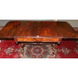 A Late Regency Mahogany Sofa Table, early 19th century, with two rounded drop leaves above one