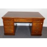 A Victorian Mahogany Double Pedestal Desk, 3rd quarter 19th century, with brown and gilt leather