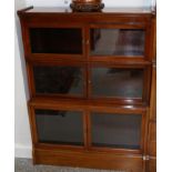 An Early 20th Century Mahogany Three Section Glazed Bookcase, with six glazed doors and raised on