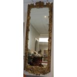 A 19th Century Gilt and Gesso Florentine Mirror, of large proportions, the rectangular mirror