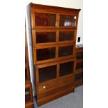 An Edwardian Mahogany and Satinwood Banded Bookcase, in five sections the upper section with six