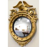 A Regency Gilt and Gesso Circular Wall Mirror, early 19th century, with a reeded and ebonised slip