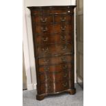 A Chippendale Revival Mahogany Serpentine Front Nine-Drawer Chest, early 20th century, with two