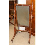 An Early Victorian Mahogany Cheval Mirror, circa 1850, the rectangular plate pivoting on turned