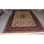 Indian Carpet, circa 1960 The ivory field of flowing vines centred by an indigo medallion framed