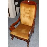 A Victorian Mahogany Framed Armchair, circa 1870, later covered in yellow velvet, with rounded arm