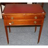 An Early 20th Century Mahogany Foldover Writing Table, with hinged leather writing surface and