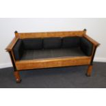 A Late 19th Century Continental Satin Birch and Ebonised Biedermeier Style Sofa, with panelled