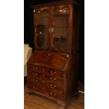 A George II Mahogany Bureau Bookcase, 3rd quarter 18th century, the dentil cornice above glazed