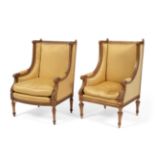 A Pair of 19th Century Carved Giltwood Fauteuils, in Louis XVI style, covered in yellow silk