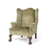 A George III Style Armchair, late 19th century, recovered in green velvet, with rounded arm supports