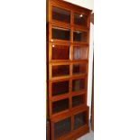 An Edwardian Mahogany and Satinwood Banded Bookcase, in seven sections with six conforming