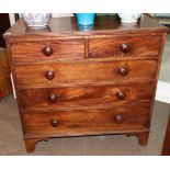 A Mahogany Straight Front Chest of Drawers, 2nd quarter 19th century, of two short over three long