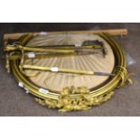 A Victorian Gilt Metal Bed Canopy, of circular form cast with foliate scrolls, 53cm diameter; and