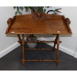 A Carved Oak Butler's Tray on Stand, late 19th century, the three-quarter gallery with scrolled