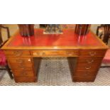 A Victorian Mahogany Double Pedestal Partners' Desk, late 19th century, with inset red leather