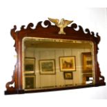 A George II Style Walnut and Parcel Gilt Overmantel Mirror, the bevelled plate within a moulded slip