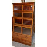 An Edwardian Mahogany and Satinwood Banded Five Piece Sectional Bookcase, the upper section with six
