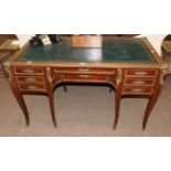 A Late 19th Century Louis XVI/Transitional Style Gilt Metal Mounted Writing Table, with inset