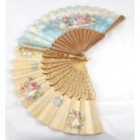Early 20th Century Carved Gilt Wood Fan, with pierced sticks and guards, cream silk leaf mount