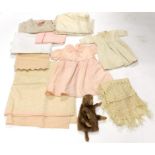 Early 20th Century Baby Dresses and Textiles, including a peach 1930s silk crepe de chine scallop