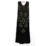 Circa 1918 Black Silk Georgette Gown, with silver bead decoration and flared hemStitched repair