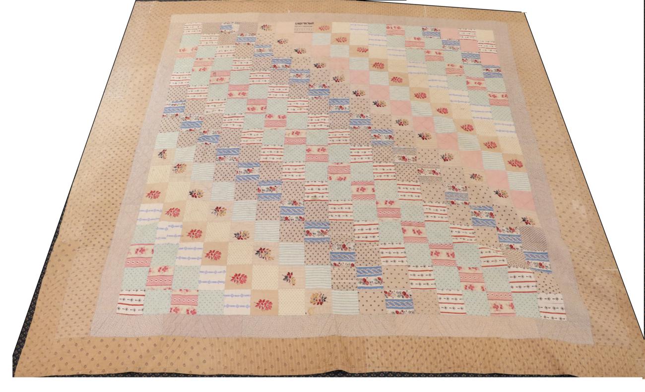 19th Century Patchwork Quilt, comprising square patches in coloured printed cottons, within two