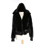 A Black Mink Zipped Jacket, with long sleeves, ribbed cuffs and waist, with detachable hood