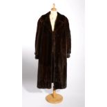 Dark Mink Fur Coat, with cuffed sleeves, side pockets, floral woven lining, and a modern
