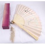 A 19th Century Ivory Fan, delicately carved with flower heads to the guards and Chinese figures to