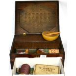 An oak box containing a quantity of buttons and sewing regalia