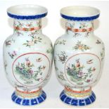 A pair of Chinese Wucai style porcelain vases In good condition, no apparent damage.