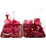 A collection of 19th and 20th century cranberry glassware including a double-ginnel flask; various