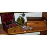 A 19th century mahogany travelling vanity box, a 19th century mahogany writing slope, barbola