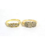 An 18 carat gold diamond three stone ring, graduated round brilliant cut diamonds in illusion