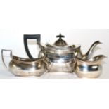 A three piece silver tea set marked for Chester