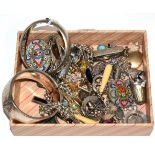 Two silver hinge opening bangles; five Victorian brooches; ten various charms; a silver cigar cutter