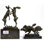 Bronze model of hares boxing, raised on marble plinth, signed Nick; together with a bronze model