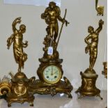 An early 20th century reproduction gilt spelter figural striking clock garniture