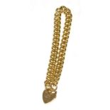 A 9 carat gold curb link bracelet with a padlock clasp, length 19cm 29.67g