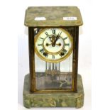 A brass and green onyx striking mantel clock by Ansonia