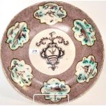 A Savona Faience circular dish, 18th century, painted in manganese with an armorial on a powdered