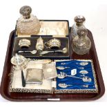 A set of six Indian silver spoons with elephant terminals, a silver card case, silver tongs, cased