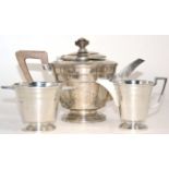 An Art Deco silver three piece tea set by Walker & Hall