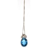 A blue paste and diamond pendant, on an 18 carat white gold chain, an oval blue paste beneath a